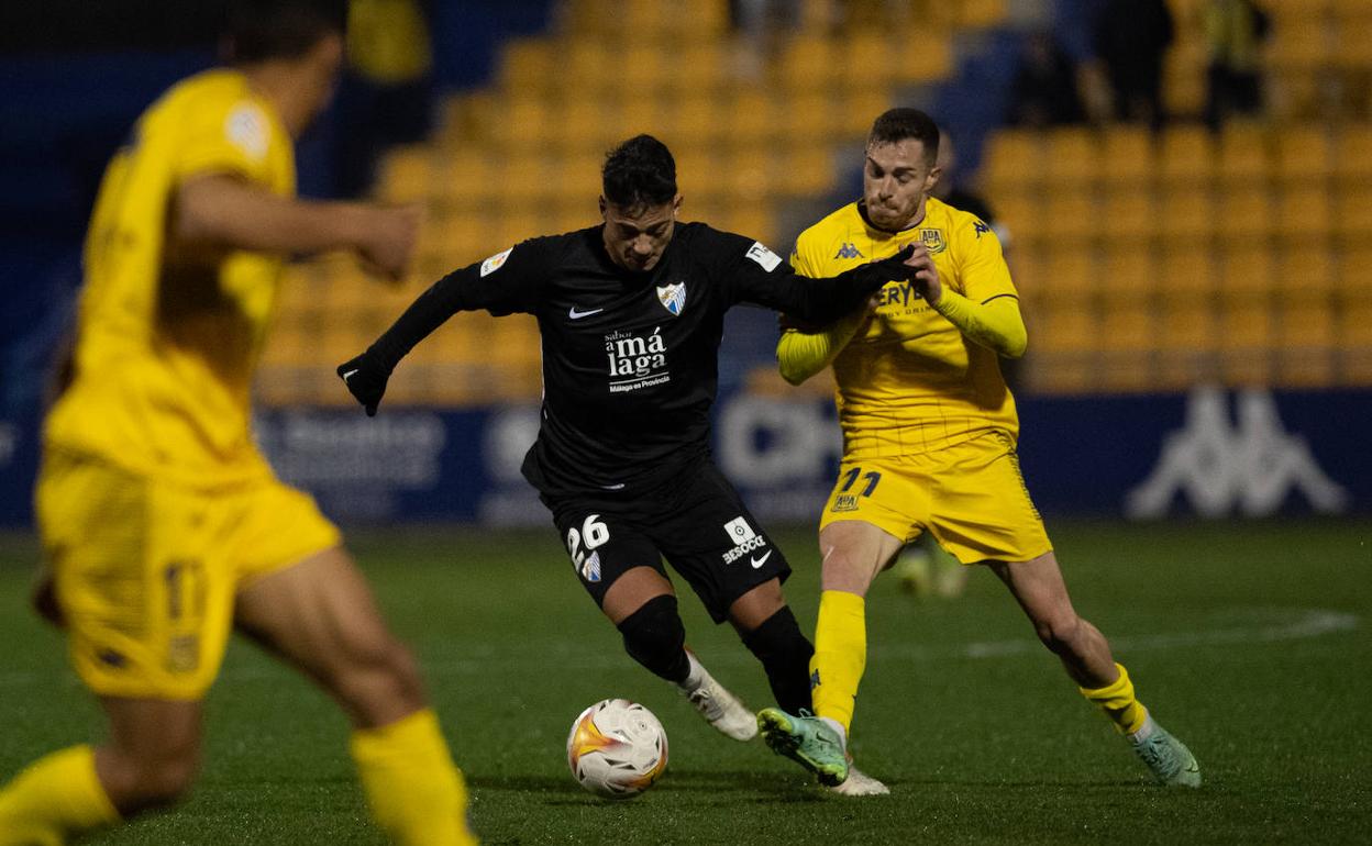 Malaga finally win away from home